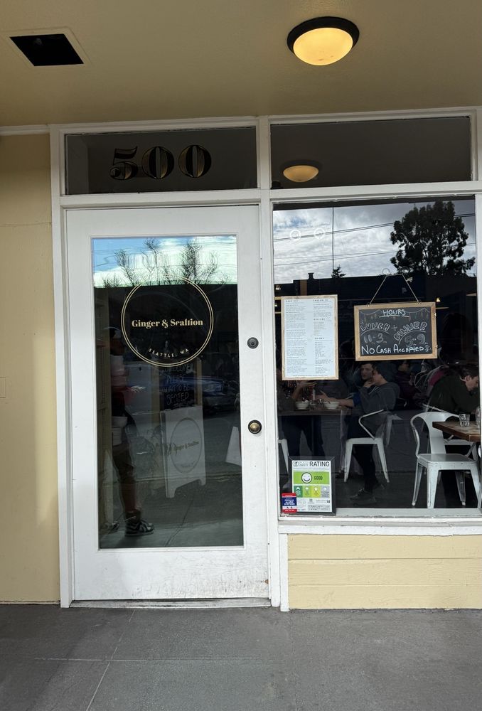 The storefront — no sign, just the menu on the glass